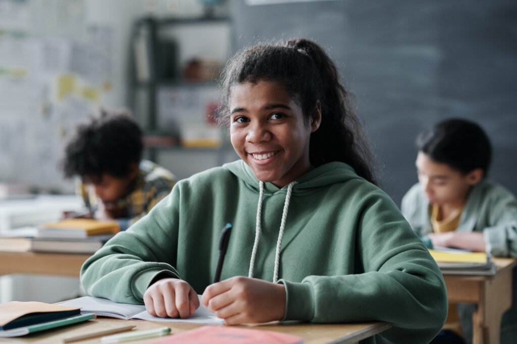 African American schoolgirl studying at school